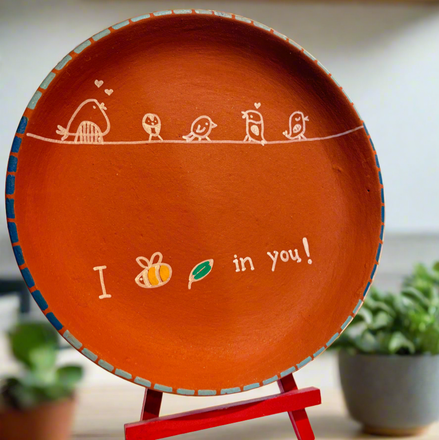 Decorative plate with a message on a stand in a kitchen setting